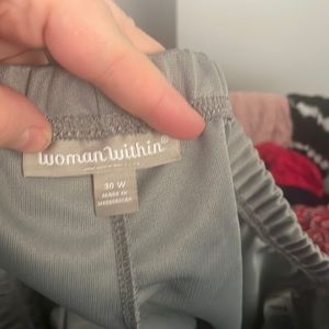 Woman within grey stretchy dress pants